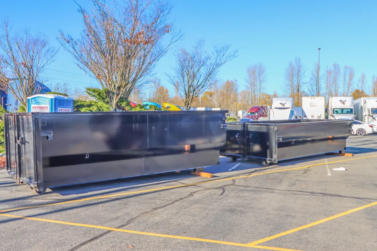 Professional dumpster rental service with roll-off container on residential driveway in Prior Lake